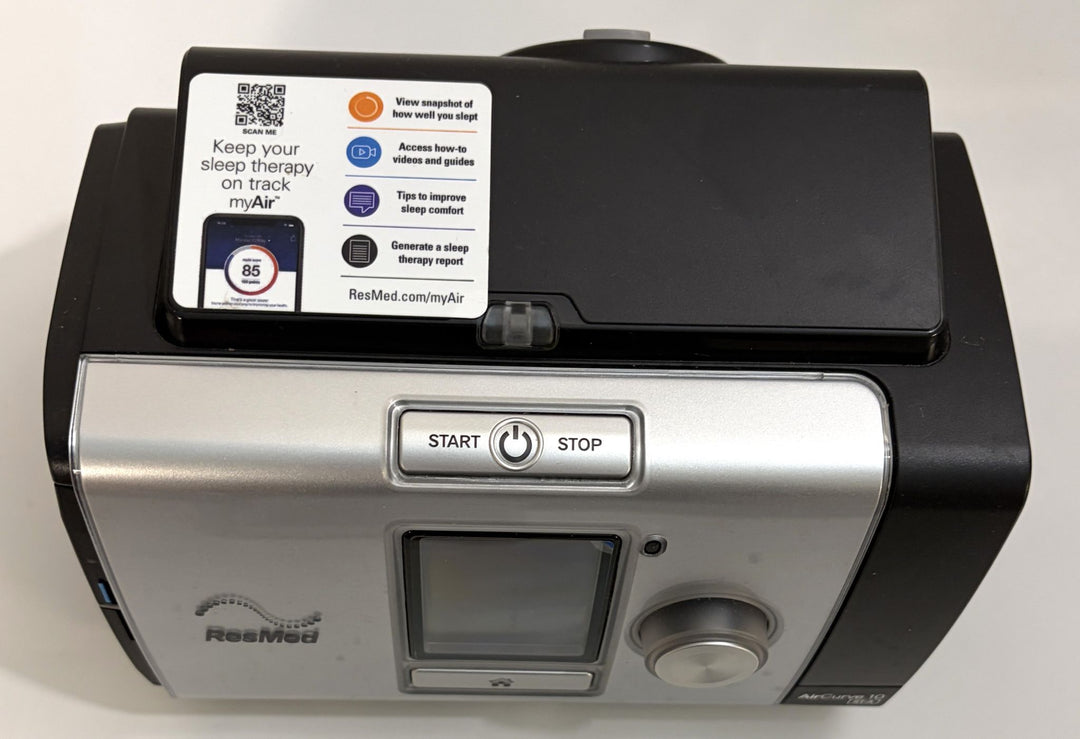 ResMed CPAP machine in black and silver with digital display, control dial, start and stop button, and myAir user guidance label