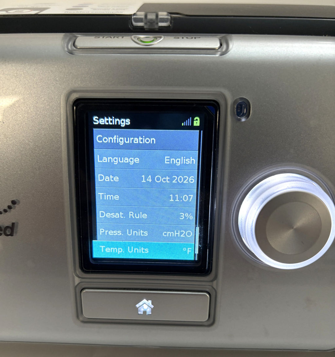 Resmed AirCurve 10 ST-A BiPAP machine control panel with illuminated settings screen and rotary dial for medical respiratory care