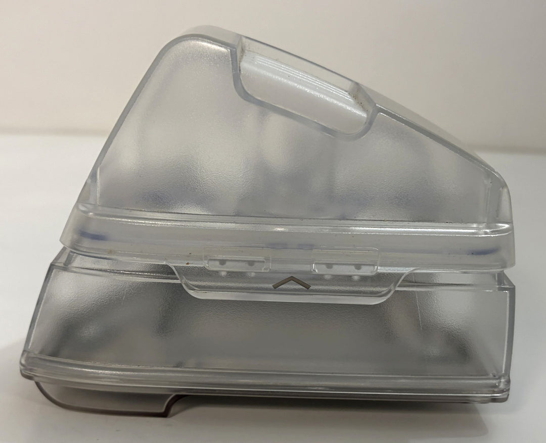 Clear plastic hinged storage container with a translucent lid, raised handle, and rectangular base on a white background