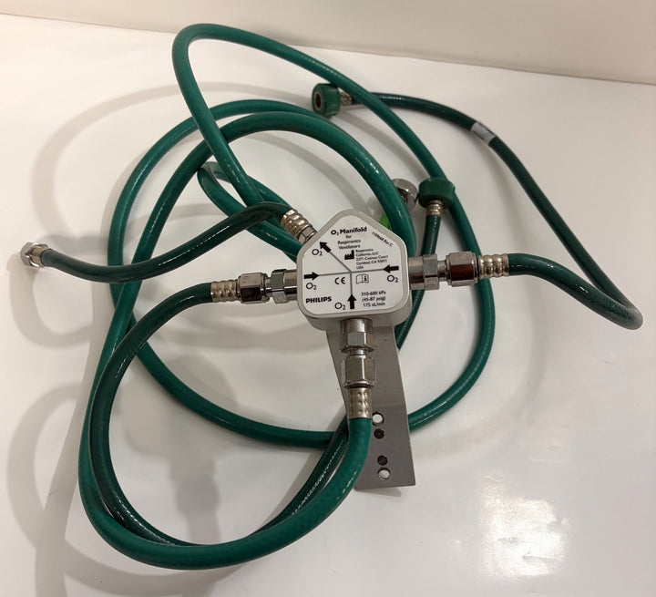 Philips Respironics O2 manifold assembly with four green oxygen hoses, part number 1109668 Rev C, pre owned medical equipment