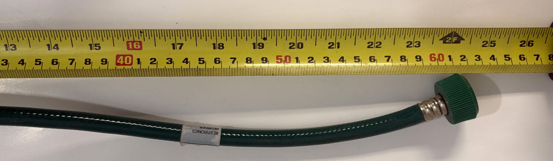 Philips Respironics V60 ventilator green oxygen supply hose with threaded connector, shown beside a measuring tape