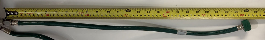 Philips Respironics O2 manifold assembly 1109668 Rev C with attached green oxygen supply hose, pre-owned medical ventilator part beside ruler