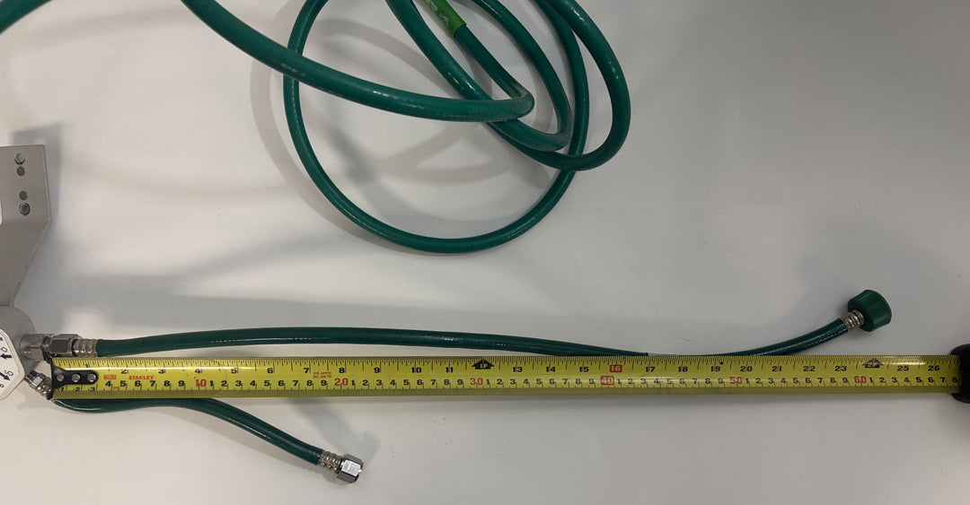 Philips Respironics O2 manifold assembly 1109668 Rev C with attached green oxygen hoses and tape measure, pre-owned medical equipment