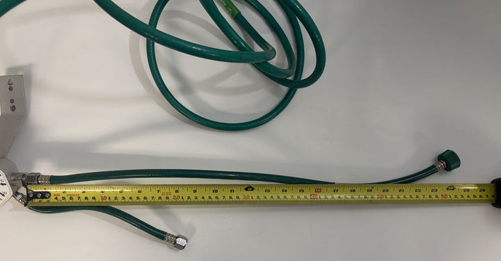 Philips Respironics O2 manifold assembly 1109668 Rev C with attached green oxygen hoses and tape measure, pre-owned medical equipment