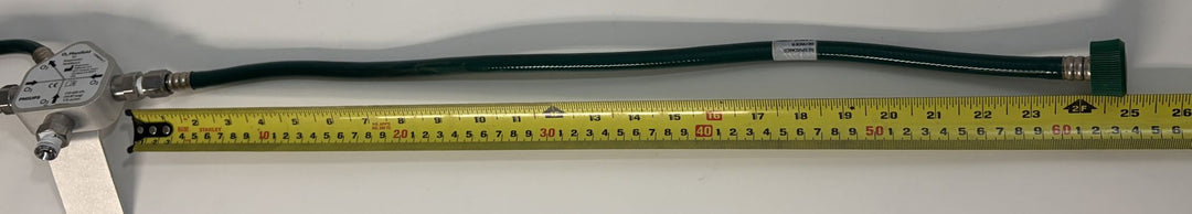 Philips Respironics O2 manifold assembly 1109668 Rev C with green oxygen hoses, shown beside a ruler, pre-owned medical equipment from PHENTERSALES