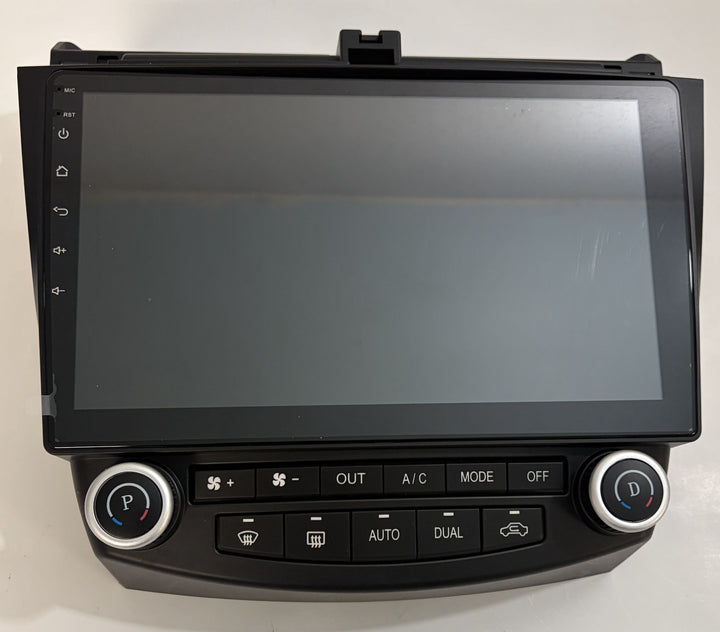 Black automotive touchscreen infotainment and climate control panel with dual temperature dials, fan controls, and rear defrost buttons