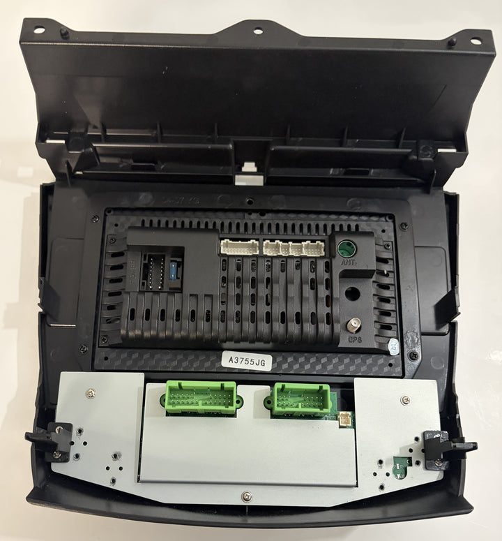 Open black electronic control module housing with multiple connector sockets, circuit board slots, mounting points, and label A3755JG visible.