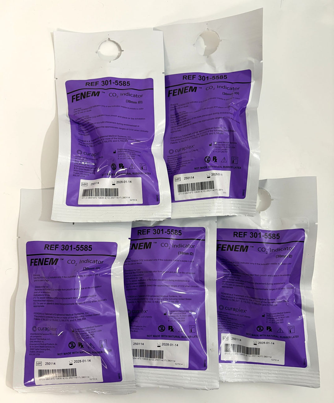 Five sealed single-use Fenem colorimetric CO2 indicator packets by Curaplex, displayed on a white surface for medical and industrial use.