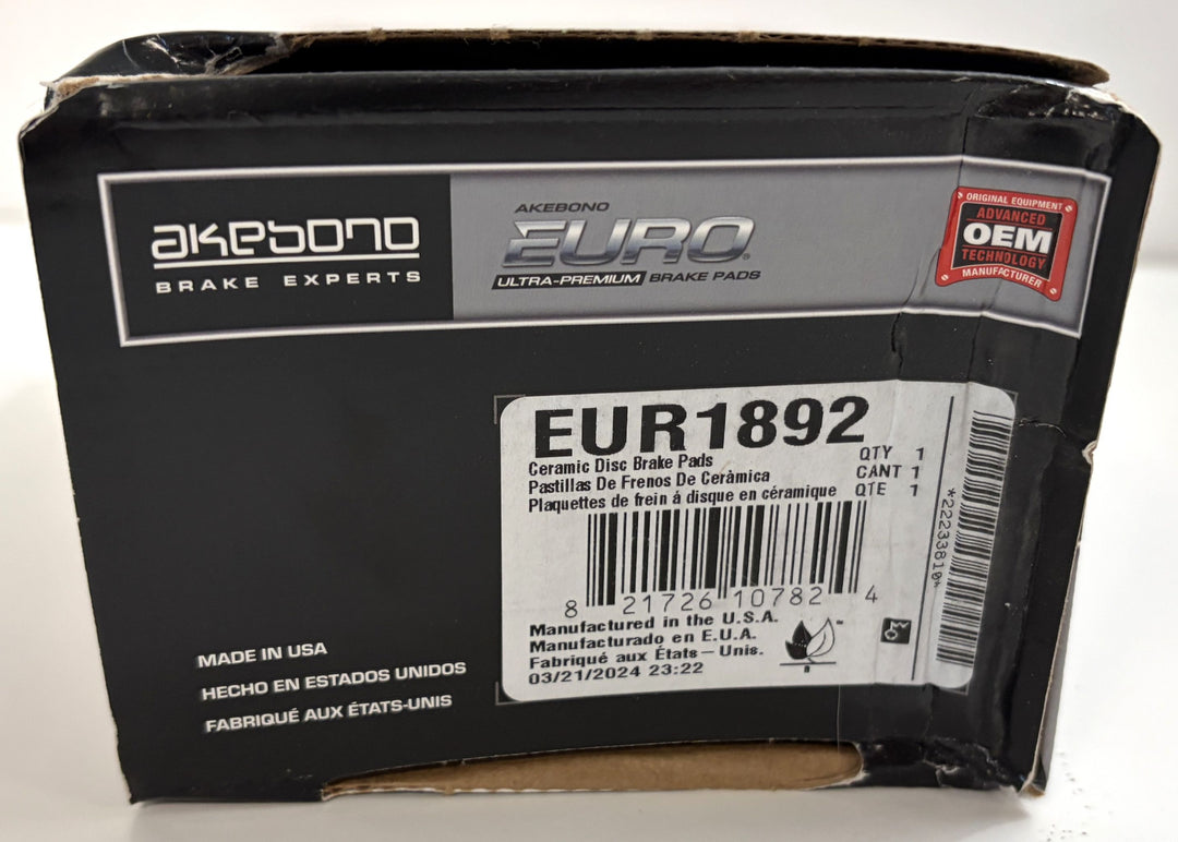 Akebono brake pad packaging with branding and product details on a white background