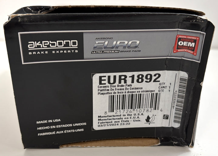 Akebono brake pad packaging with branding and product details on a white background