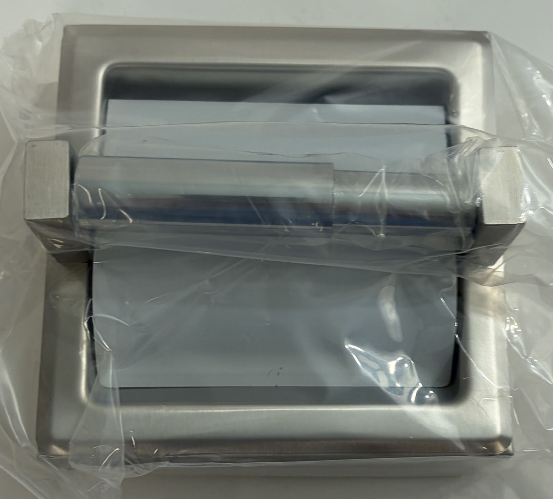 Stainless steel ASI toilet paper holder with satin finish, featuring a protective hood and frame, shown wrapped in clear plastic packaging on a white background.