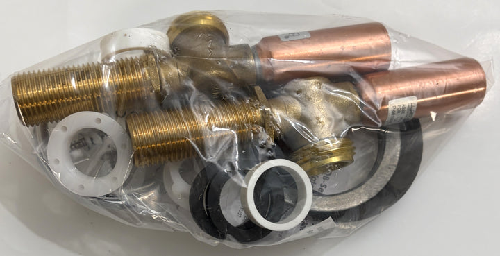 Set of brass and copper plumbing parts in clear plastic packaging on a white background
