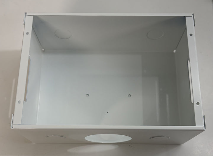 Metallic box with circular cutouts on a white background