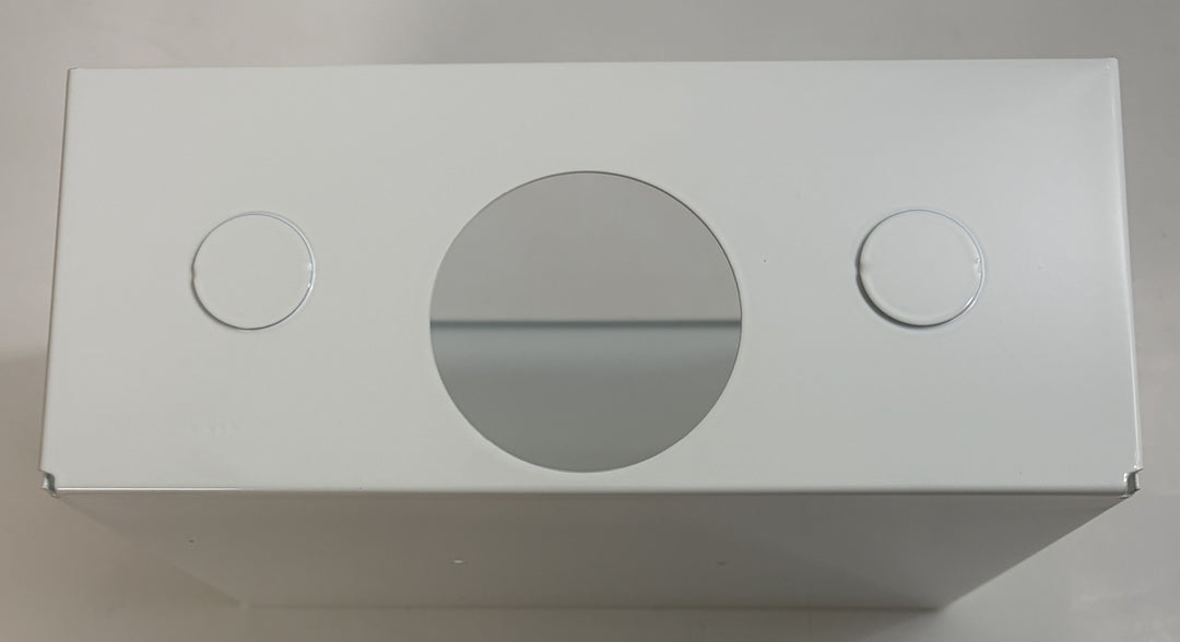 White rectangular box with circular cutouts on a gray background