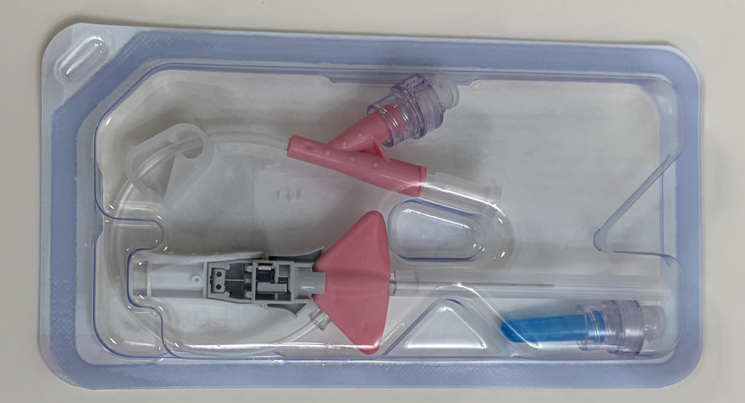 Sterile medical device in sealed packaging featuring a BD dual port closed IV catheter system with a pink winged needle and tubing designed for intravenous access.