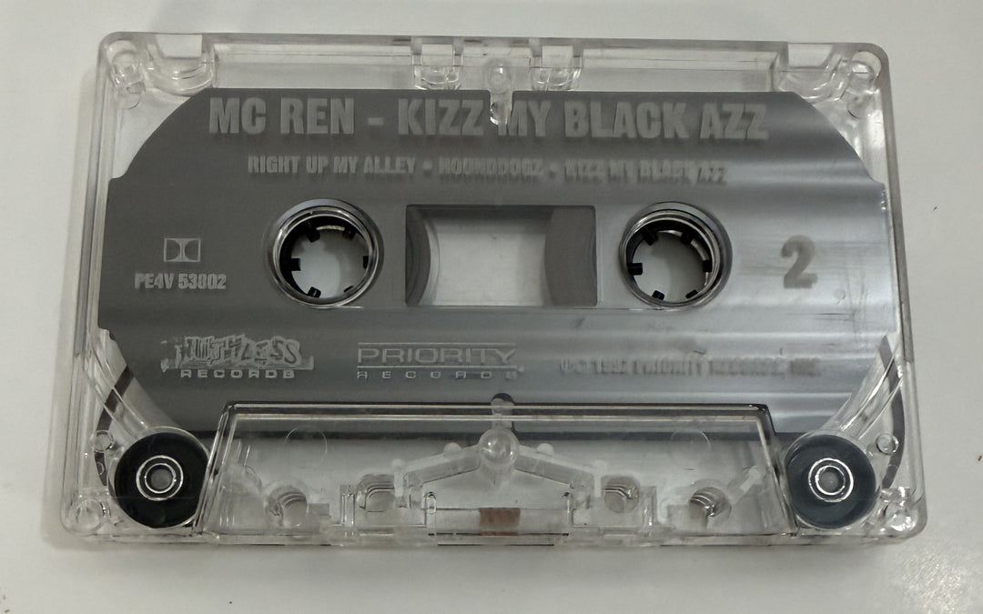 Pre-owned clear plastic audio cassette featuring "MC Ren Kizz My Black Azz" with Ruthless and Priority Records logos, capturing vintage music media style.