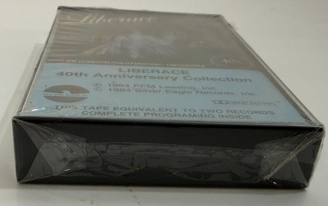 Sealed cassette tape of Liberace’s 40th Anniversary live performance with London Philharmonic, packaged by PFM/Silver Eagle Records, shown in protective shrink wrap.