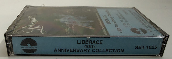 Side view of a sealed Liberace 40th Anniversary Collection cassette tape by PFM/Silver Eagle Records with blue spine label and vintage design details.