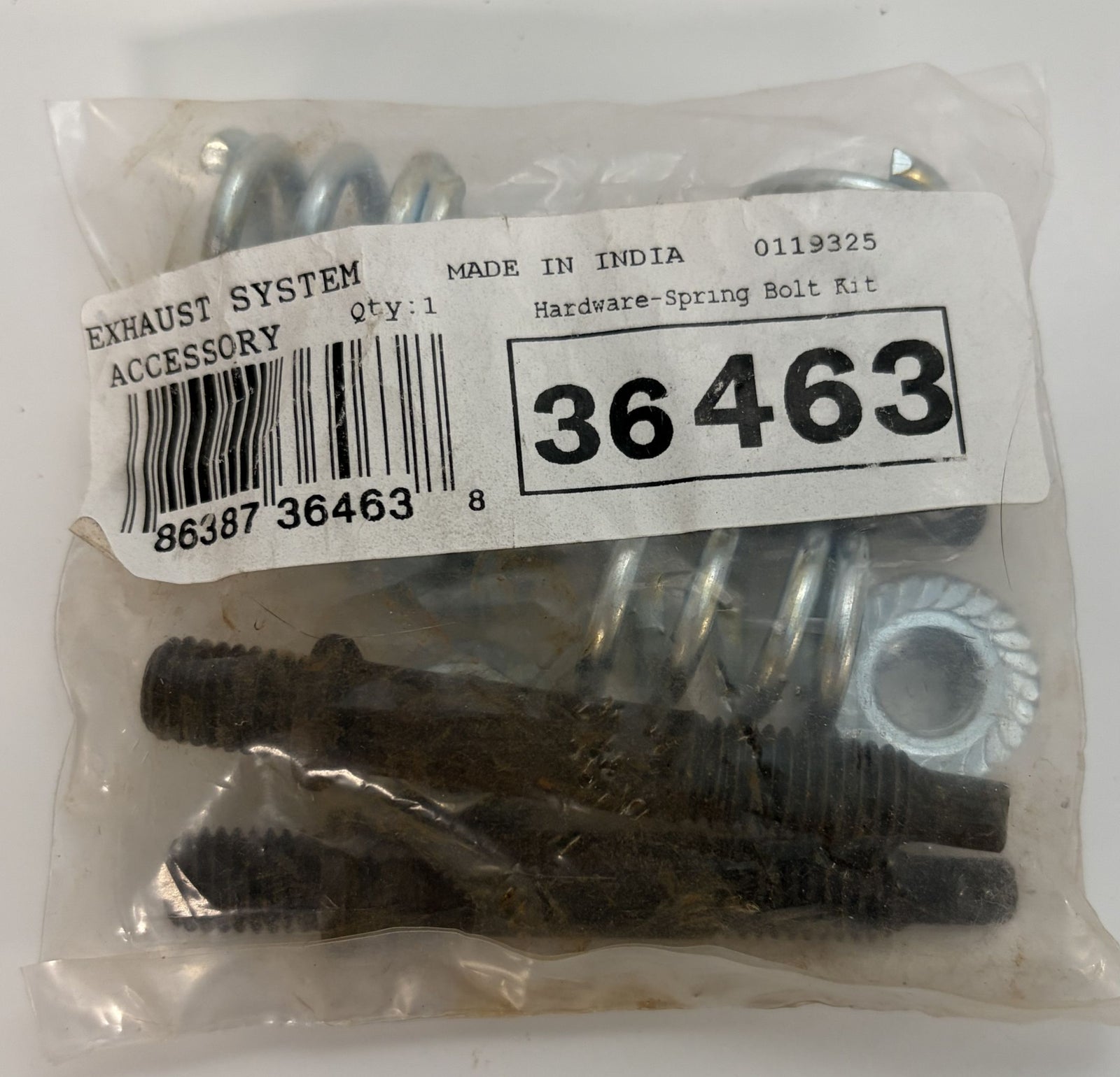 Clear plastic bag containing a spring bolt kit for exhaust systems with metal springs and bolts showing minor surface rust, labeled with product details and barcode.