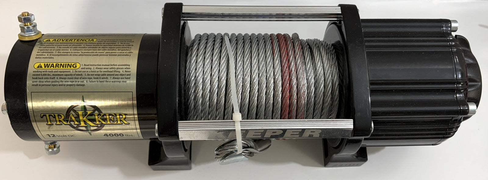 Keeper electric winch with durable steel cable wound on a black spool, featuring gold-toned motor housing and compact design for heavy-duty lifting tasks.