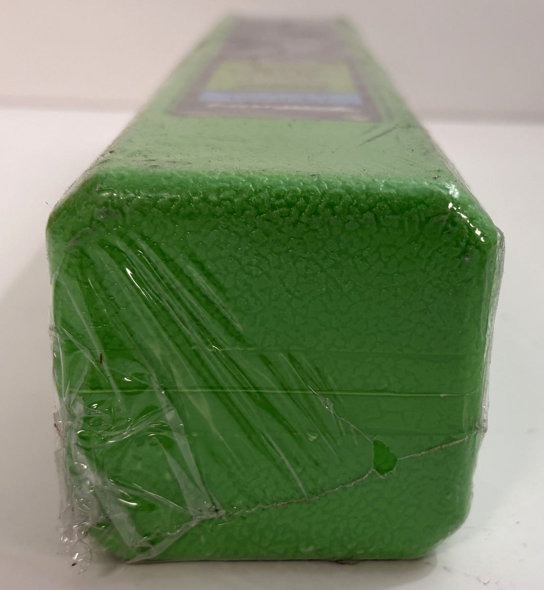 Green textured plastic case wrapped in clear protective plastic, designed to hold Forney premium welding electrodes for industrial and business use.