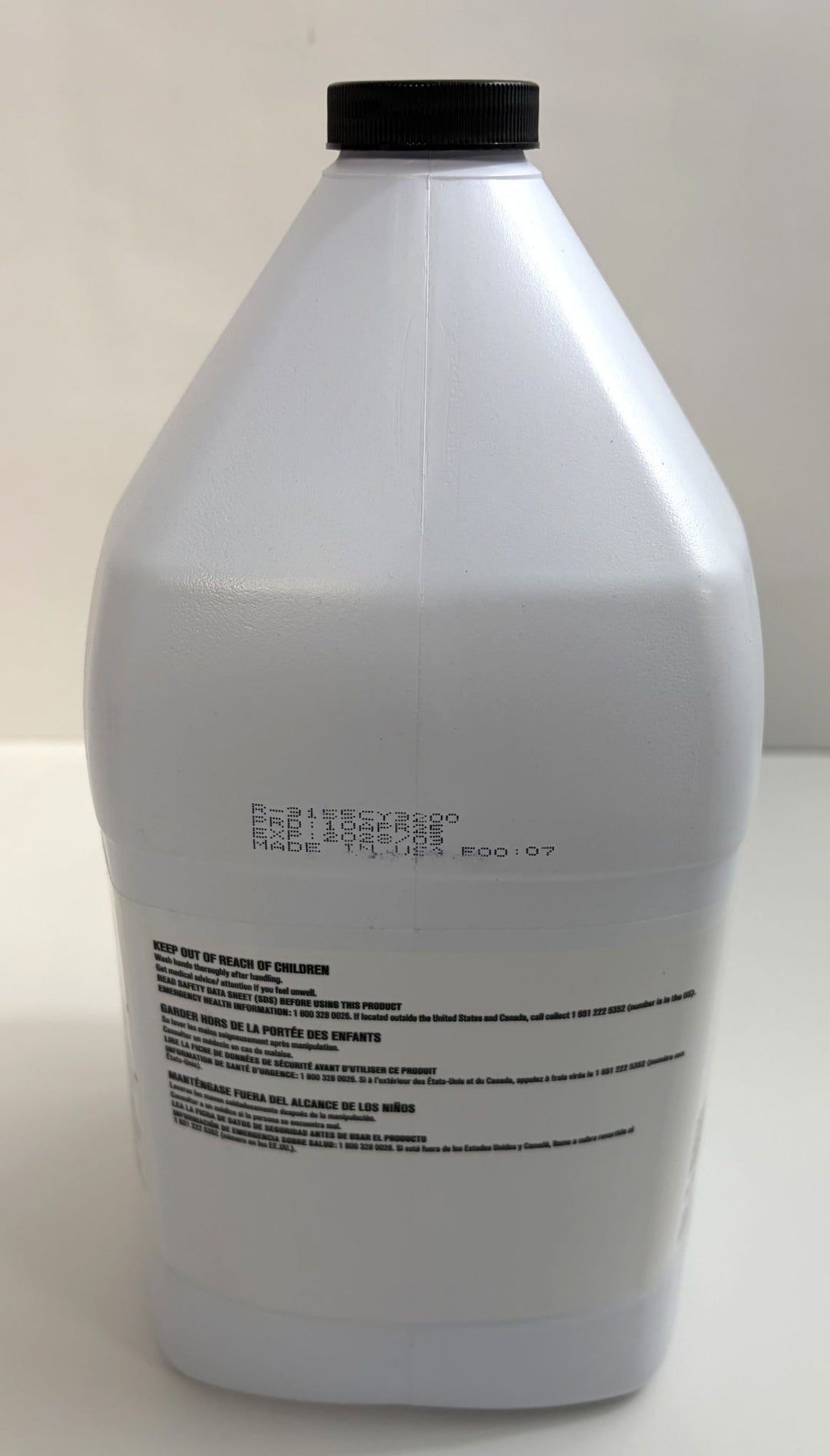 White plastic container with a black screw cap, displaying safety and usage warnings in multiple languages, part of Ecolab’s industrial cleaning product lineup.
