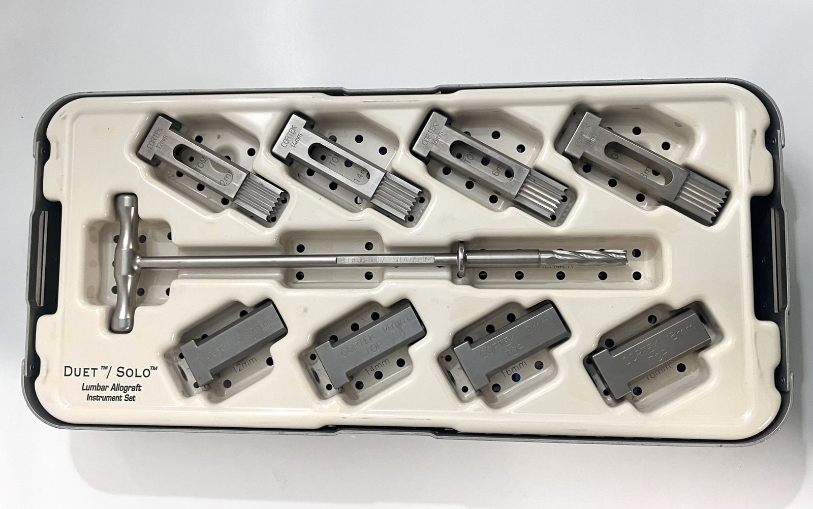 Duet/Solo Lumbar Allograft Instrument Set by Cortek with case, includes reamers, guides, and tomes.