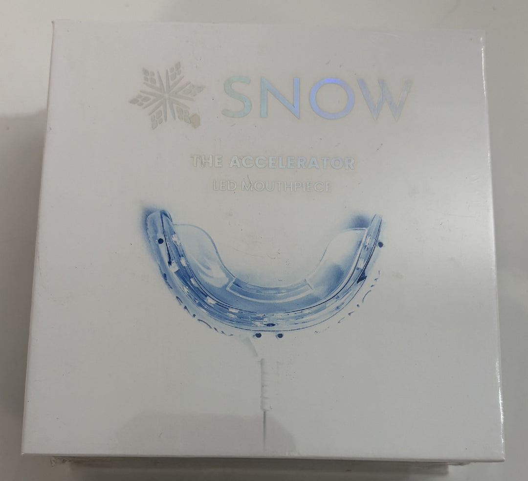 White retail box for a Snow brand LED teeth whitening mouthpiece device featuring a clear blue-tinted mouth tray image on the front against a plain background.