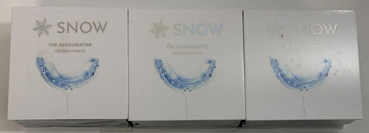 Three Snow brand LED mouthpiece devices for teeth whitening displayed in white packaging with blue mouthpiece illustrations on the front.
