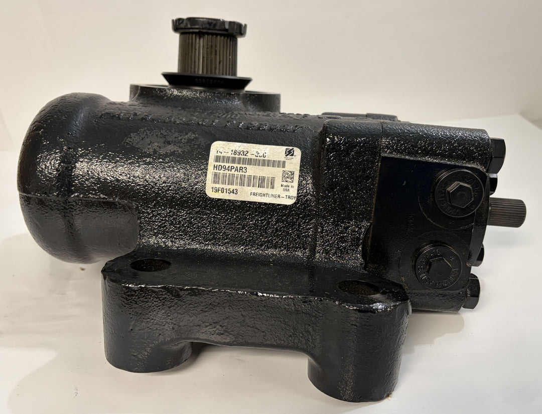 Black industrial steering gear with a textured finish, featuring visible serial labels and mounting holes, designed by Sheppard for business and automotive use.