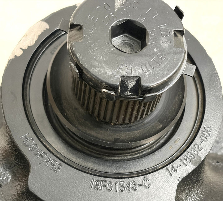 Close-up of a black metal steering gear part by Sheppard, featuring embossed model numbers and a hexagonal bolt head on a clean surface.