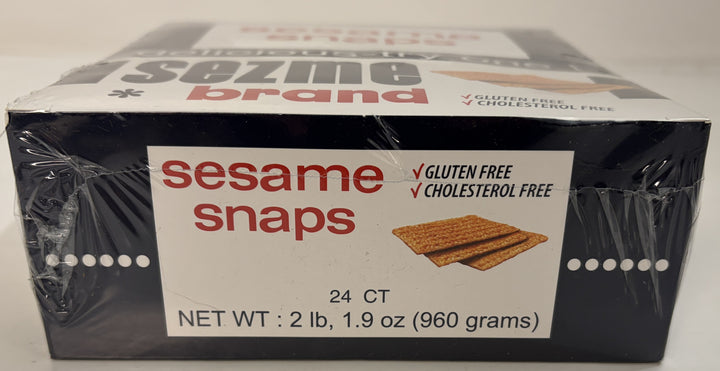 Box of Sezme brand sesame snap snack bars with gluten free and cholesterol free labels, showing a count of 24 bars and net weight information on the side.