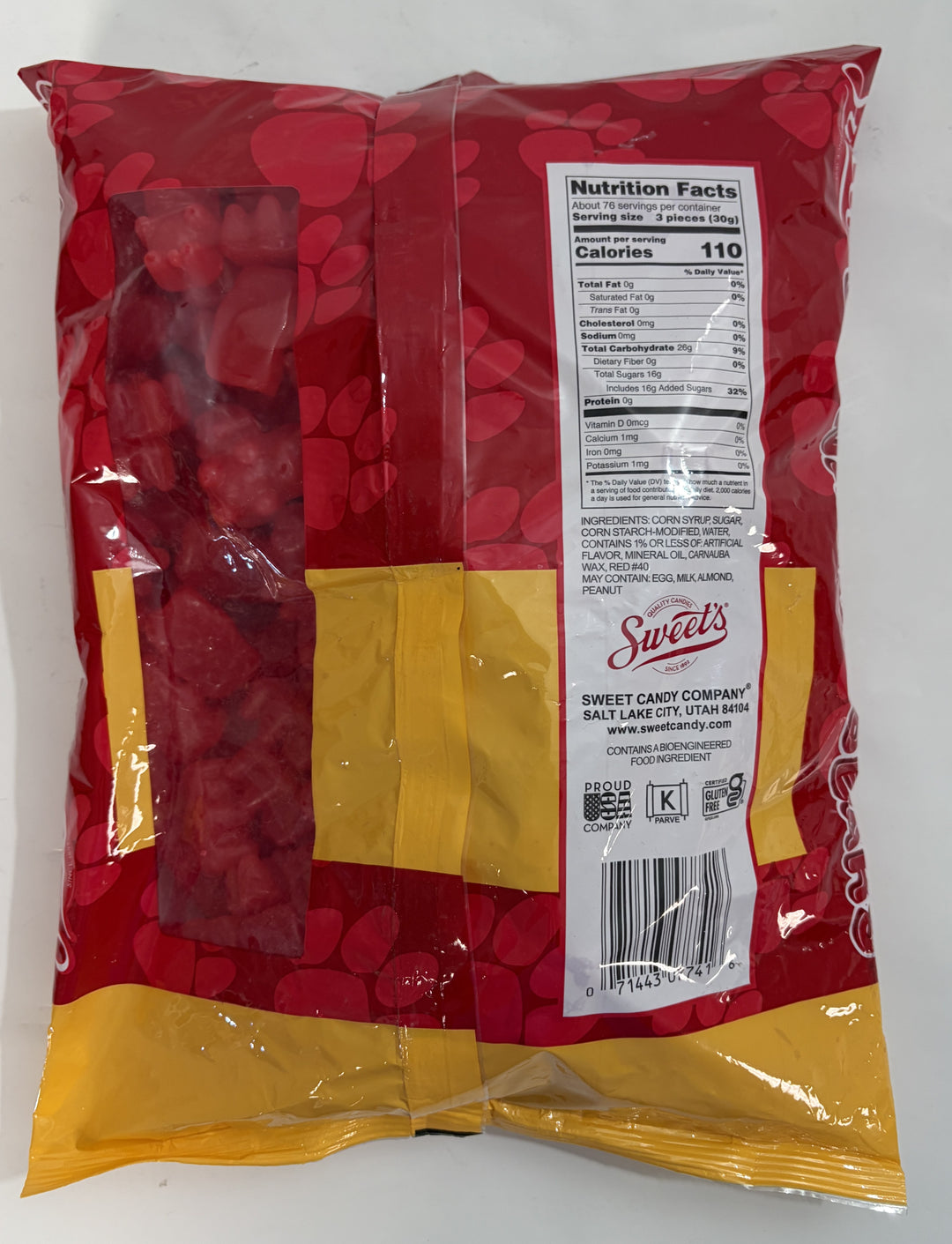 Back view of a large clear-red and yellow bag of Sweet Candy Company cinnamon bear candies showing nutrition facts and ingredient details on a white label.