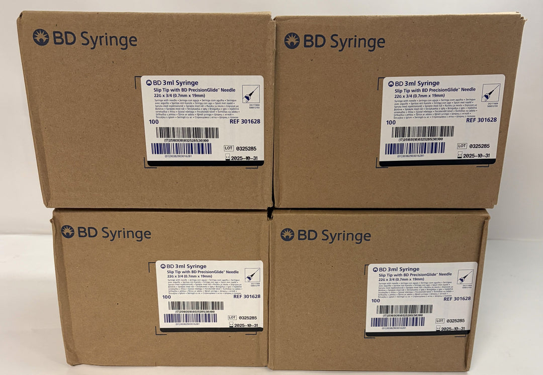 Four stacked cardboard boxes labeled BD Syringe, each showing product details for 3mL syringes with 22G needles intended for veterinary and training applications.