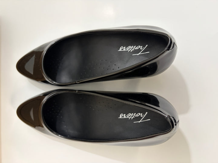 Two black shoe inserts with &
