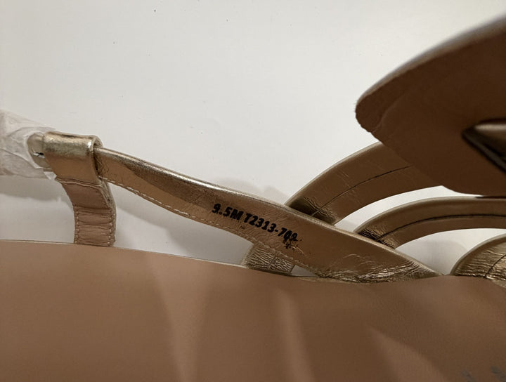 Close-up of a sandal with a strap and visible brand name on a white background