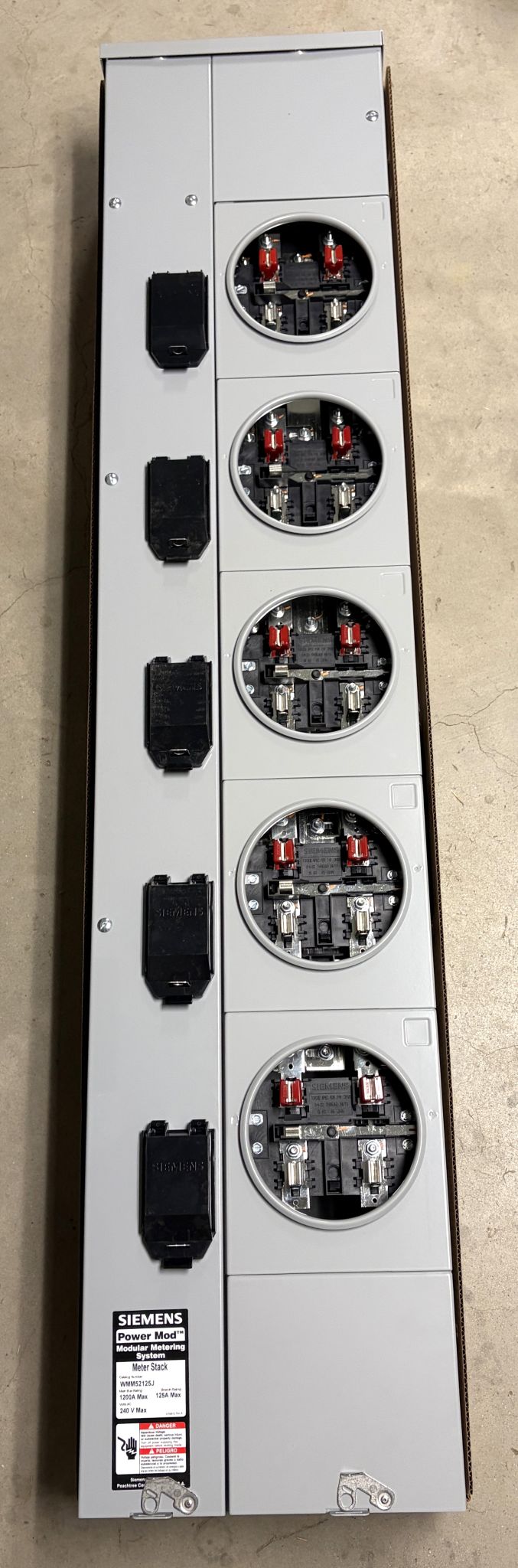 Vertical Siemens electrical meter panel featuring five round 5-jaw ring type sockets with protective covers and labeled specifications on a gray metal housing.