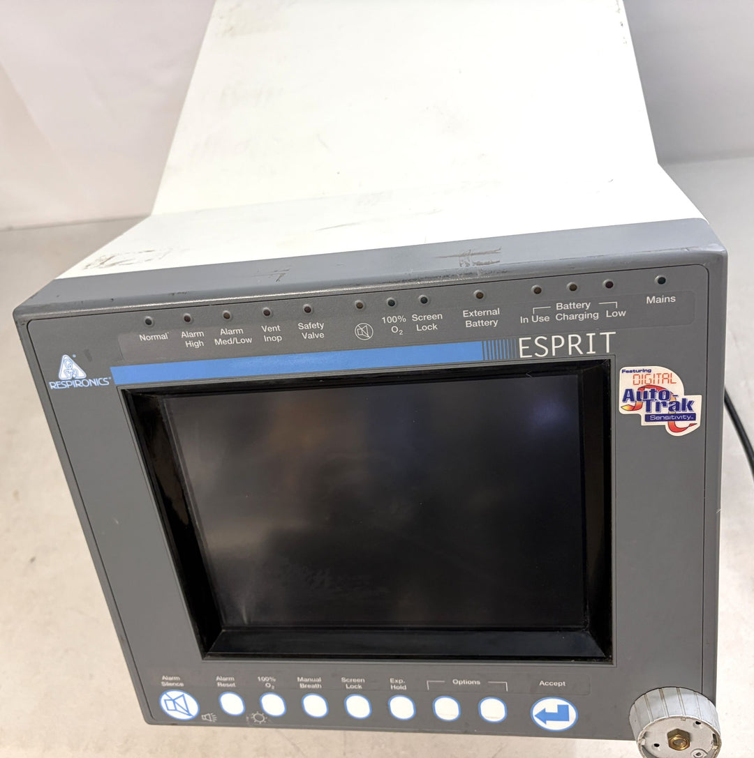 Philips Respironics Esprit medical device core unit with blank screen, buttons for alarms and settings, and visible wear on white casing against a white background.