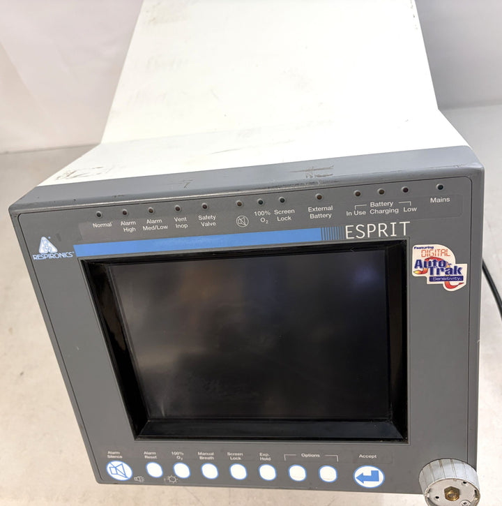 Philips Respironics Esprit medical device core unit with blank screen, buttons for alarms and settings, and visible wear on white casing against a white background.