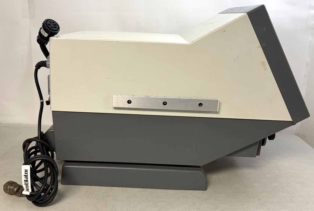 Side view of a Philips Respironics medical device core unit for parts or repair featuring a blank screen, attached cables, and a gray and white plastic casing.