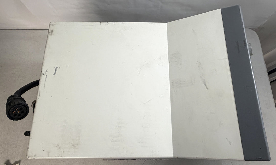 Top view of a white and gray Philips Respironics Esprit V1000 core unit for parts and repair with a visible black connector cable against a neutral background.