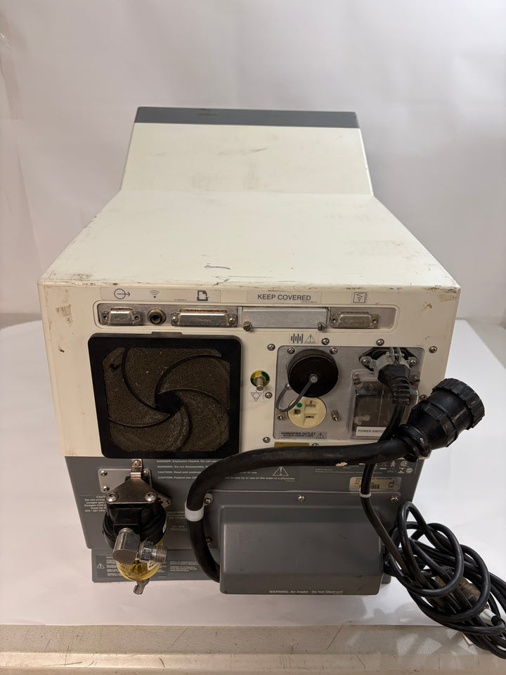 Rear view of a used Philips Respironics device unit for parts or repair showing power cable, ventilation fan, and connection ports on a plain white background.