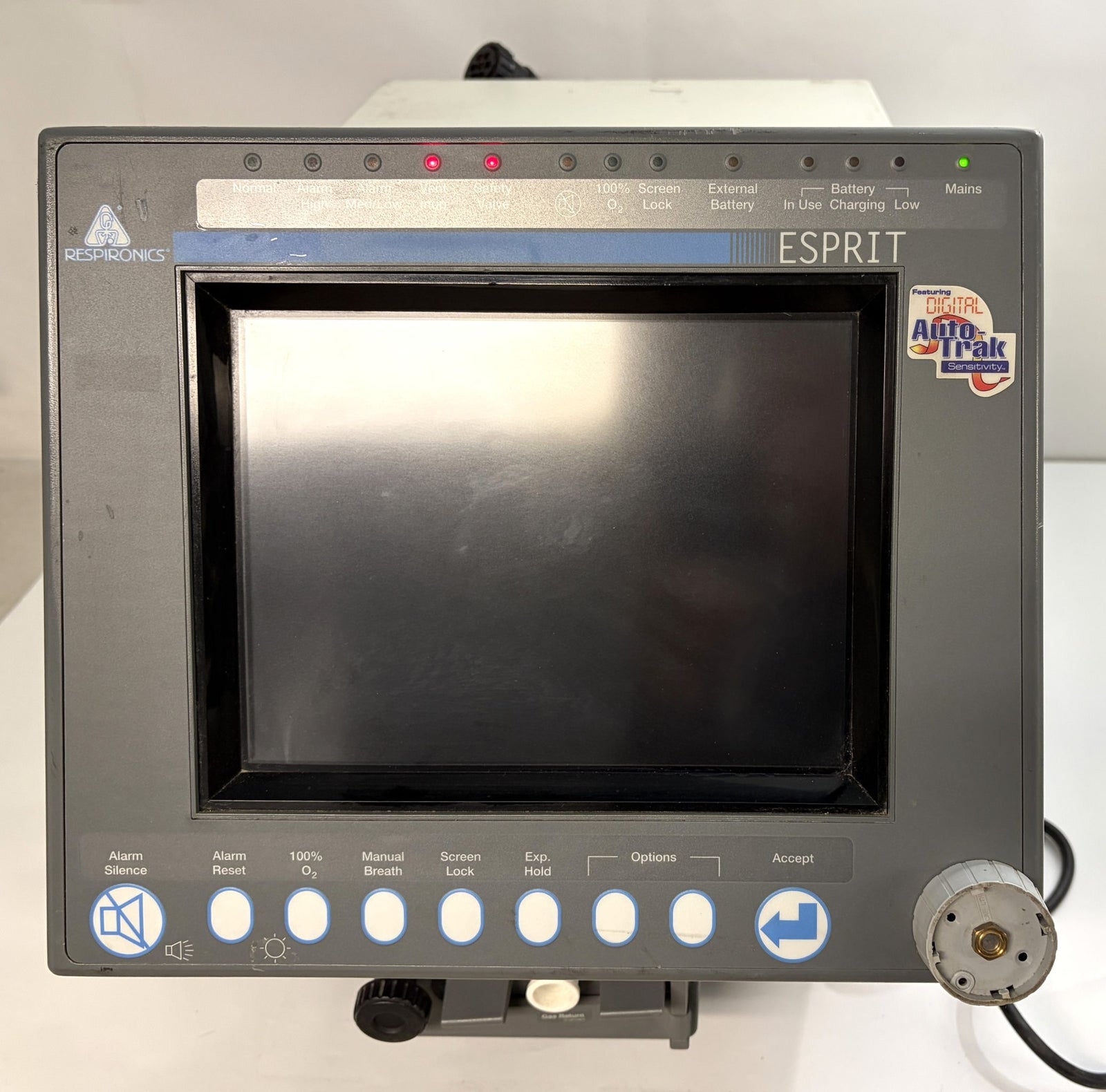 Philips Respironics Esprit medical device core unit shown from the front with a blank screen and control buttons below, powered on with indicator lights illuminated.