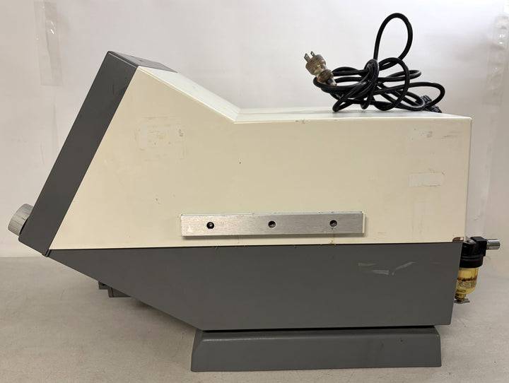 Side view of a gray and off-white Philips Respironics medical device core unit with a power cord coiled on top, designed for parts or repair use.