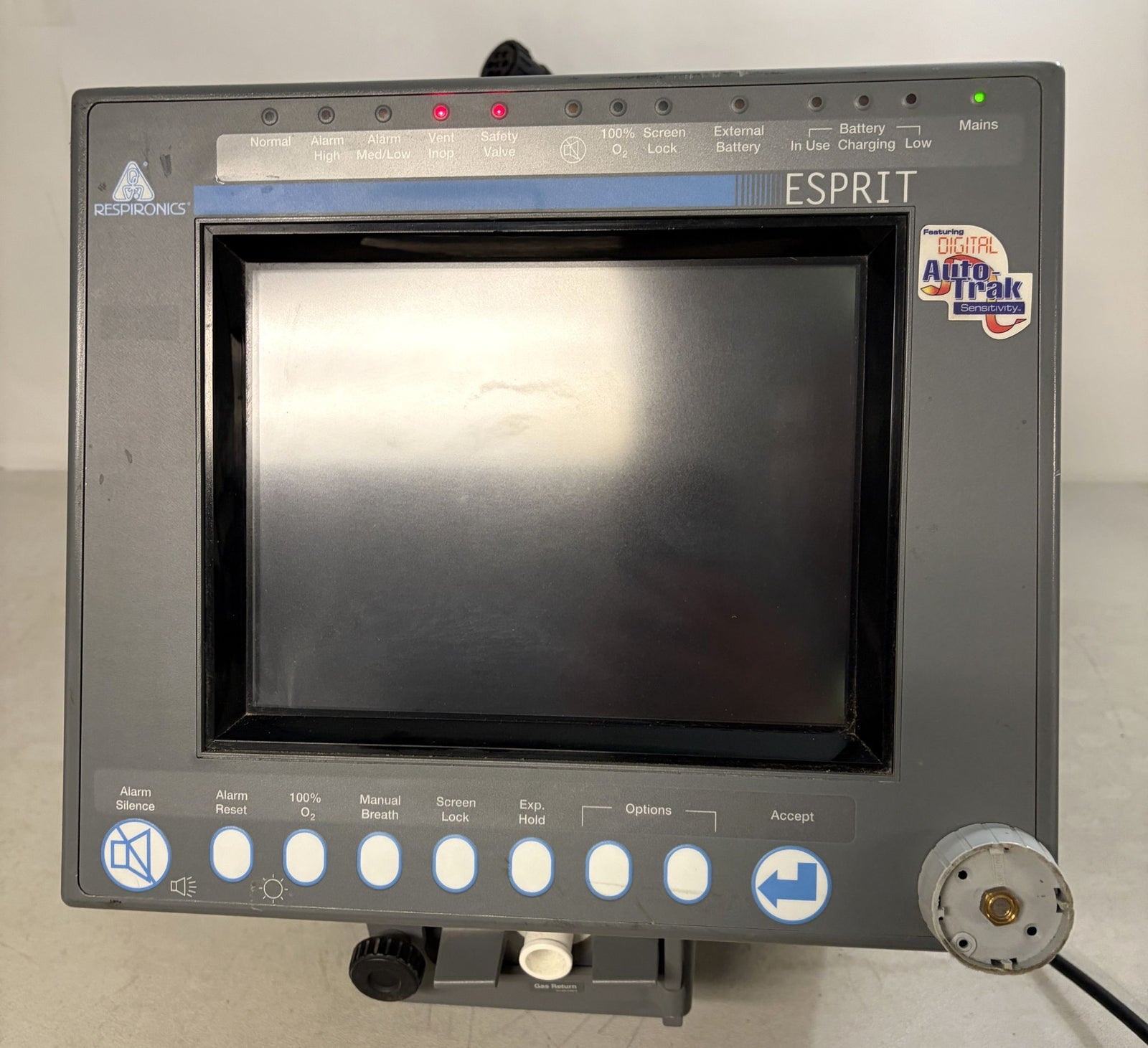 Front view of a Philips Respironics Esprit V1000 core unit for repair with a blank screen, control buttons, indicator lights, and a connected power cable on a neutral background.