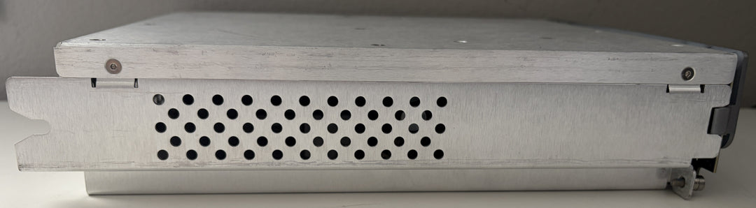 Metallic electronic device with perforated design on a gray background