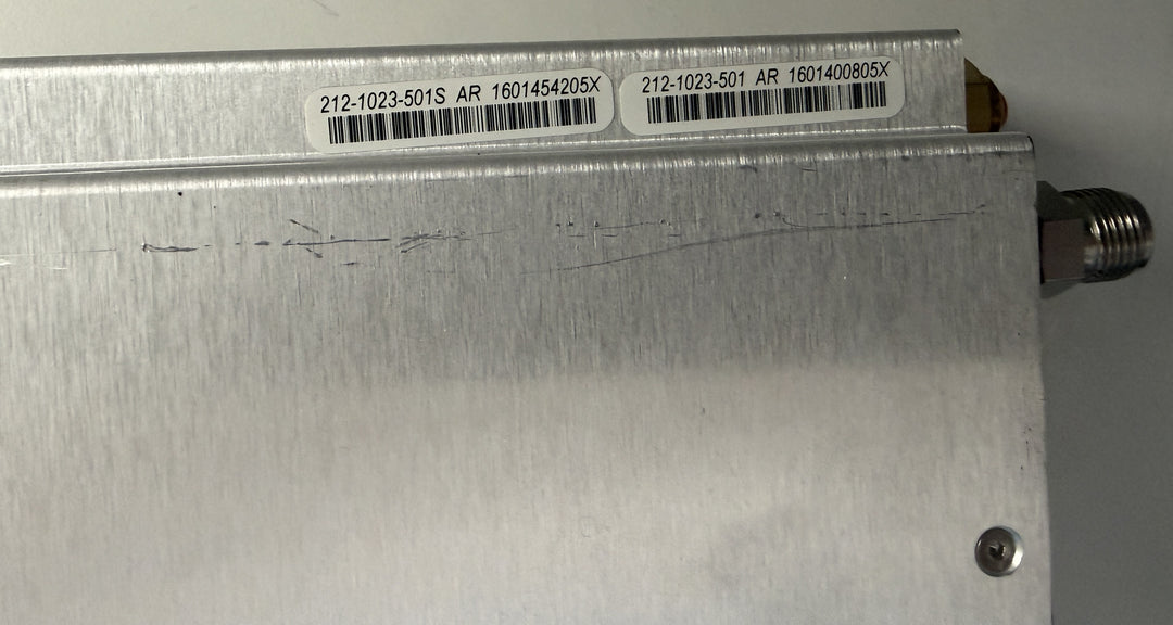 Metallic device with barcodes and text on a gray background