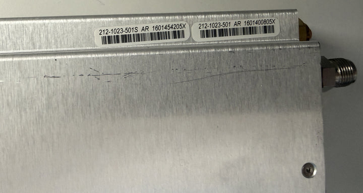 Metallic device with barcodes and text on a gray background