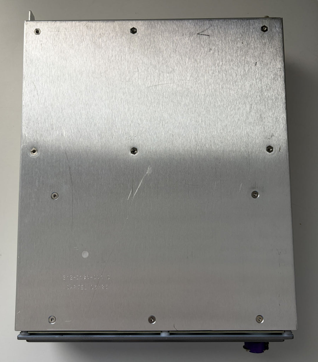 Metal box with screws on a plain background