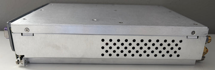 Metallic electronic device with perforated design on a gray background